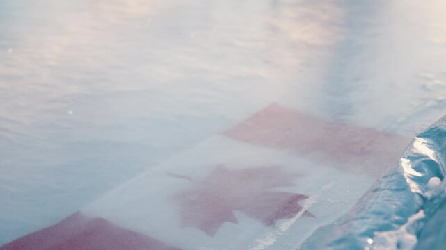 Tilt from canadian flag to outdoor hockey net