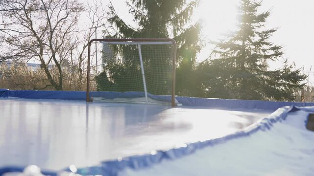 Outdoor hockey rink slider shot slow motion
