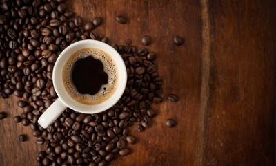 Naklejka premium Aromatic delight: coffee beans surround a cup of rich, dark brew on wood