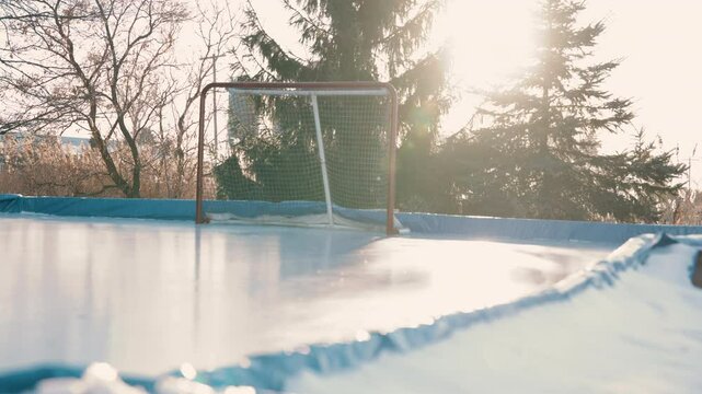 Outdoor hockey rink slow motion slider cold weather