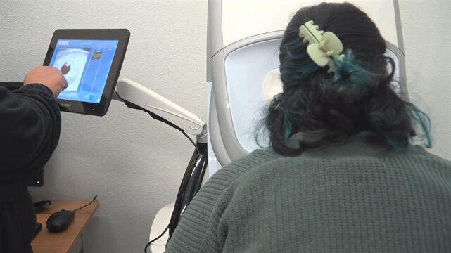 Fundus Photography - Optometrist Examining Patient's Eye Seen On The Screen. - closeup shot
