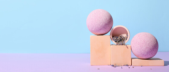 Composition with lavender bath bombs on color background