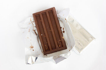 A whole milk chocolate bar isolated on white background.