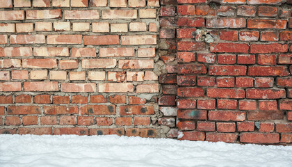 Fototapeta premium Weathered textures of rustic brick wall with snow