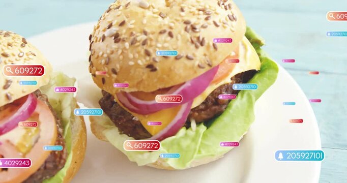 Colorful data tags overlaying animation of hamburgers with sesame seed buns
