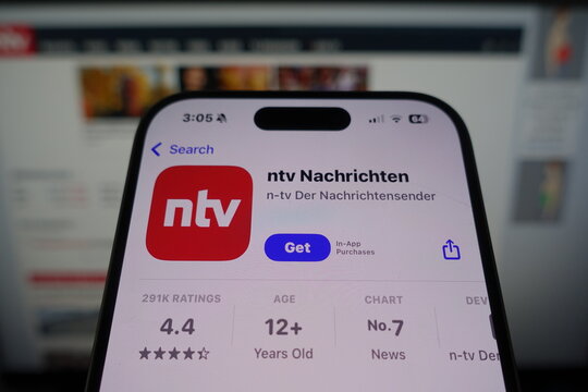 Kiel, SH, Germany March 27 2025: Ntv Nachrichten app by ntv in the App Store on smartphone screen with company's website in background showing additional content