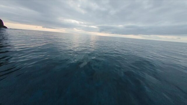 Serene ocean view at Ponta do Pargo, Madeira, with calm waters and a cloudy sky