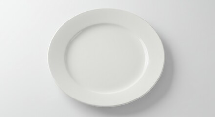 A simple top down shot of an empty white ceramic plate centered on a plain white background surface area