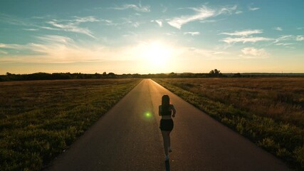 silhouette sports girl running along road sunset, outdoor sports training, urban marathon runner crossing finish line, sprint endurance exercise, street evening, sports track morning, runner jogging