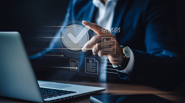 A business professional utilizes digital compliance tools to ensure company operations meet regulatory standards, emphasizing the integration of technology in maintaining quality and system integrity.