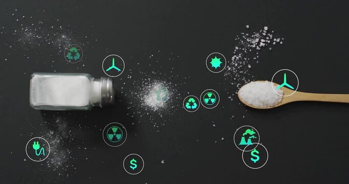 Environmental icons with salt shaker and spoon on black background in animation