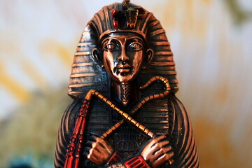 Ancient Egyptian ruler figurine.