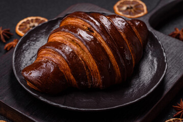 Sweet fresh crispy croissant with chocolate filling