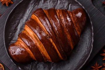 Sweet fresh crispy croissant with chocolate filling