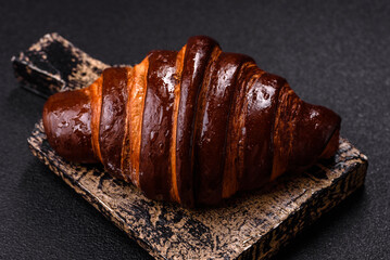 Sweet fresh crispy croissant with chocolate filling