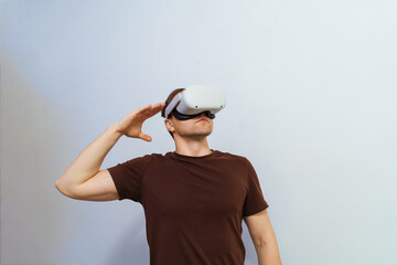 Man wearing virtual reality headset.A young guy in glasses and technology is a lifestyle future guy.