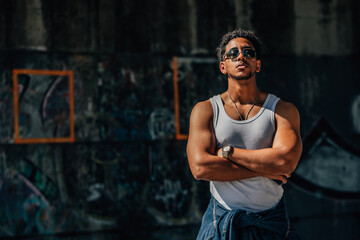 portrait of a young man on the street in urban style