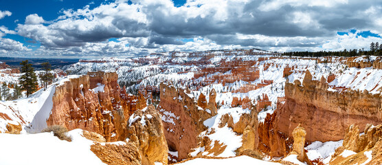 Panorama landscape of pinnacles of Bryce Canyon National Park covered in snow, Utah USA
