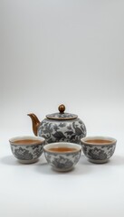 Elegant tea set with teapot and cups on a white background  