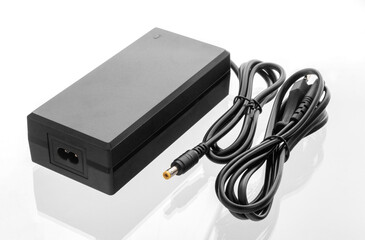 Electric bike charger, AC adapter on isolated white background