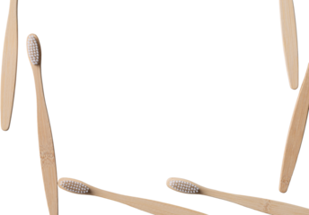 Set of ECO friendly wooden bamboo toothbrushes. Save the planet or NO plastic concept. Isolated on white background.