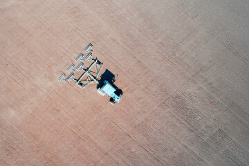 Agrotechnical technique of the sowing company. A tractor with a trailed set of rollers rolls the...