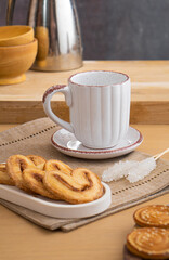 Ceramic teacup and saucer set on kitchen table