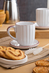Ceramic teacup and saucer set on kitchen table