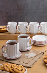 Ceramic teacup and saucer set on kitchen table