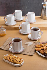 Ceramic teacup and saucer set on kitchen table