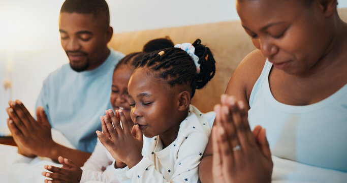 Worship, relax and prayer with black family in bed for trust, spiritual morning and bonding. Support, God and christian faith with parents and children at home for religion, gratitude and catholic