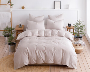 Scandinavian style bedroom with double bed, four pillows and duvet. Top view photo