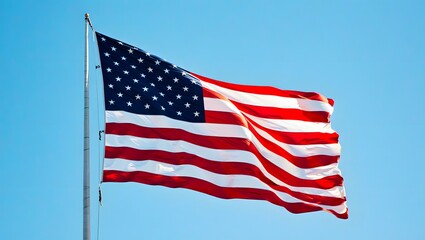 flag of united states waving in the wind against a bright blue sky