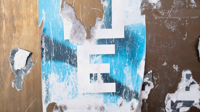 Torn and ripped old street poster background, vintage paper texture video backdrop