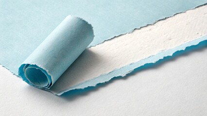 Obraz premium light blue paper peeling from white surface isolated on white background.