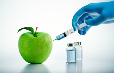 Green apple with injection by syringe on a white background - 3D illustration - concept for...