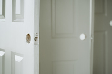 Smooth round holes are made in the leaf, where door fittings will later be installed.