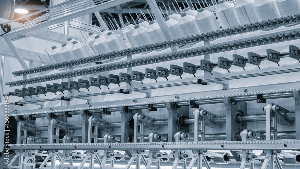 Aufkleber a machine is weaving a piece of fabric. the machine is made up of many parts, including a large meta