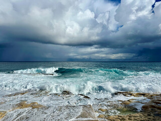Storm in the Mediterranean Sea and waves crashing on the beach in Sliema, Malta