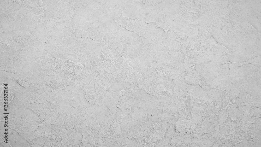 Poster a white wall with a grey texture. the wall is smooth and has a somewhat rough texture. the wall is a