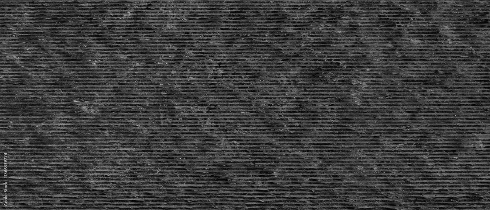 Aufkleber Dark gray stone wall with rough texture as a background for a template or banner. The wall is made of stone and has a gray color.