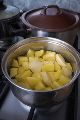 Cooking potatoes, in the kitchen. Dinner
