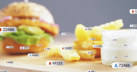 Animation of burger and fries with social media notification icons overlaying - Powered by Adobe