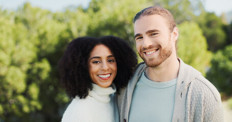 Outdoor, couple and portrait with hug for love, bonding together and connection in healthy relationship. Nature, man and woman with smile for embrace, interracial marriage and care on weekend holiday