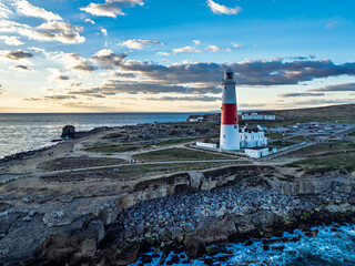 Sunset over Portland Bill Lighthouse from a drone, Portland Bill, Isle of Portland, Dorset, England
