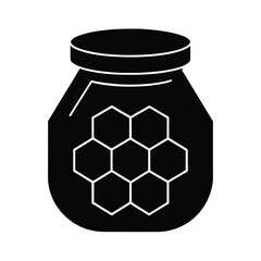 jar of honey with honeycomb