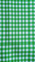 Naklejka premium Vibrant green and white checkered fabric texture, surface, home