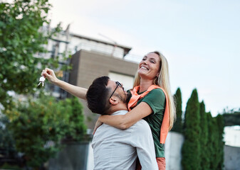 key woman man house new apartment home wife husband owner real estate togetherness couple buying...