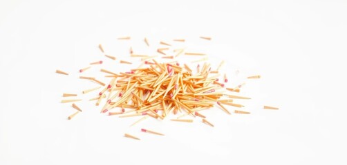 Obraz premium Scattered toothpicks on pristine white background, sharp focus, toothpicks, light, close-up