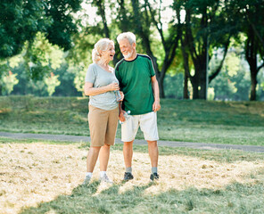 Fototapeta premium woman senior man outdoor running couple lifestyle sport smiling together jogging healthy nature fit happy active retirement exercise fitness run